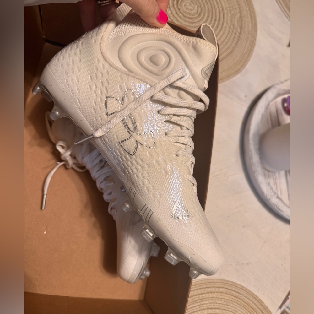 Men’s football cleats , originally $129. Asking $38. Brand new only tried on